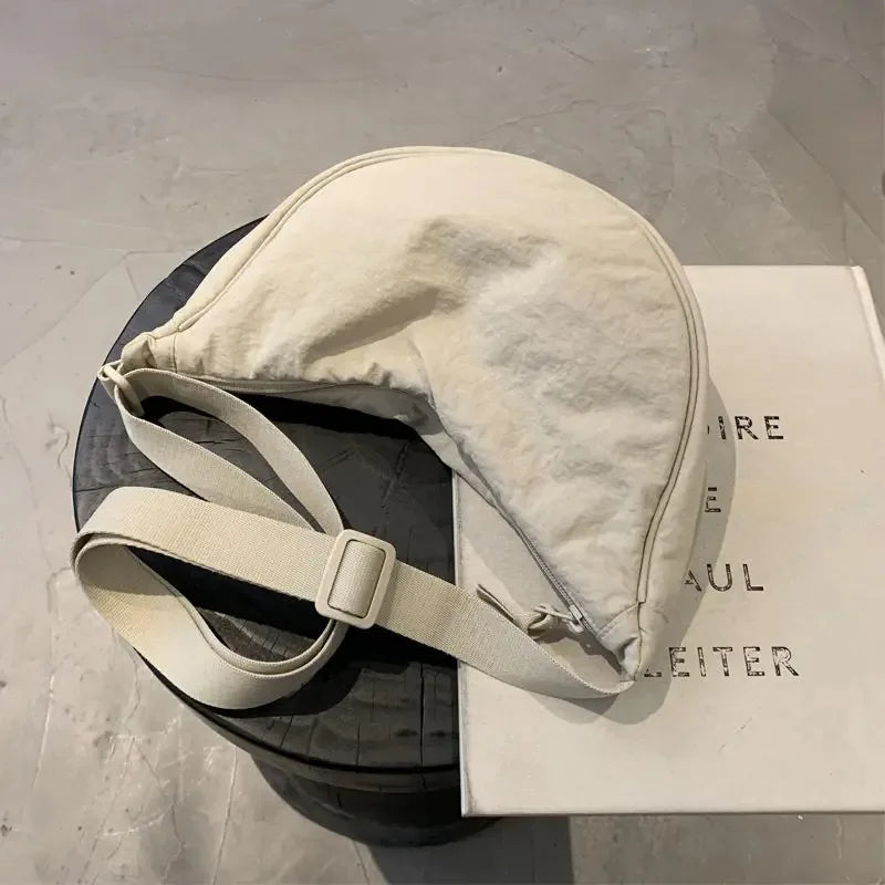 Riñonera de media luna unisex