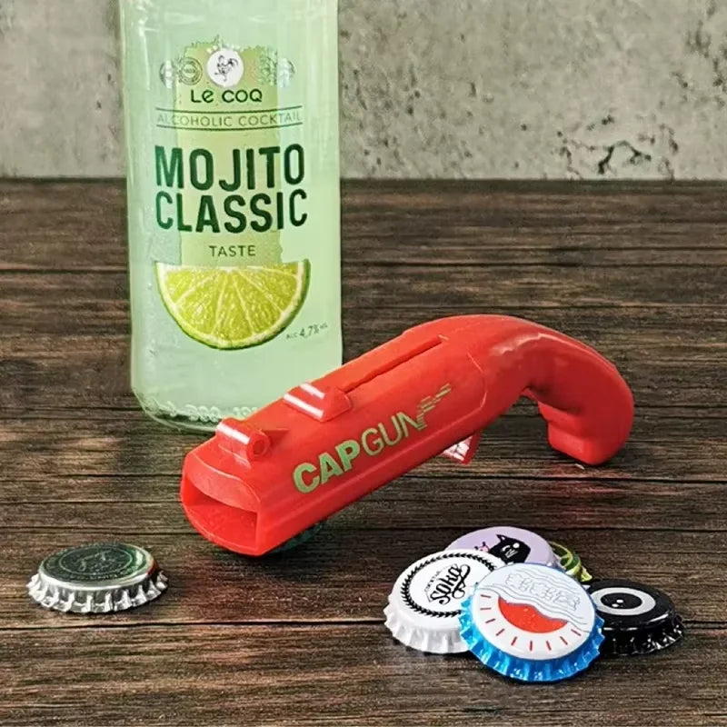 Pistola lanza chapas y abrebotellas